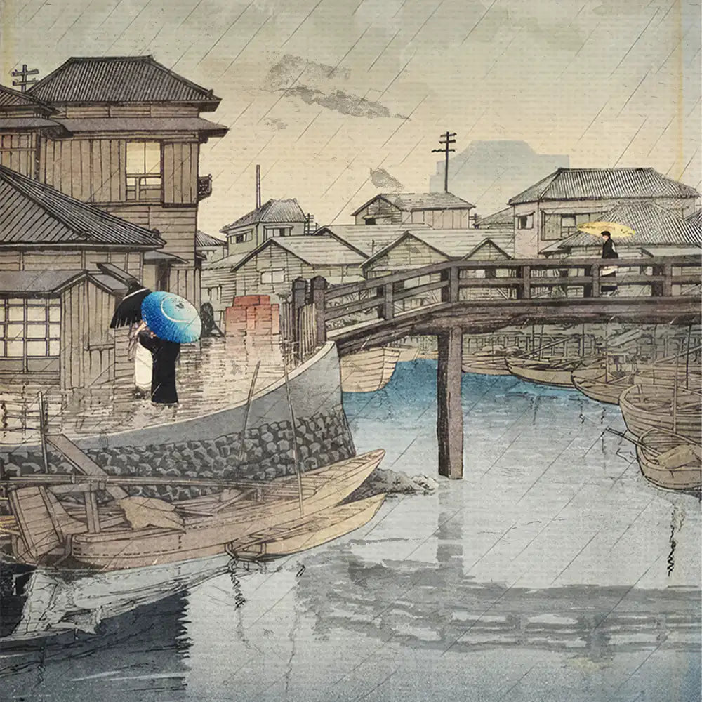 Japanese landscape painting depicting a rainy scene with wooden houses, a bridge, and figures holding umbrellas by a waterfront.