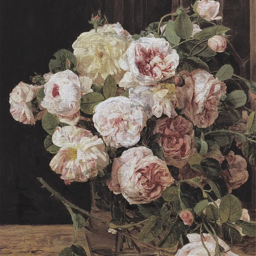 A bouquet of delicate pink and white roses in a glass vase against a dark background.