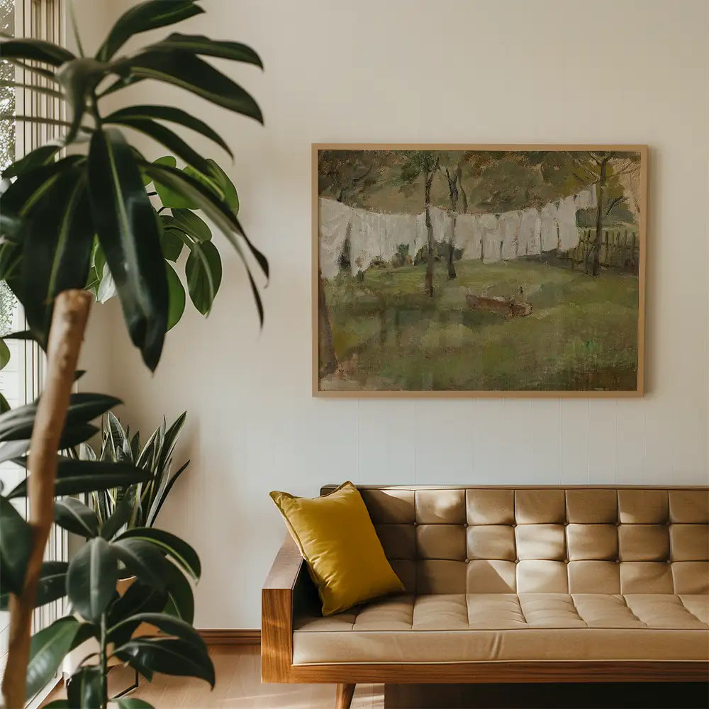 A framed painting of a serene landscape featuring trees and white laundry hanging on a line, displayed on a light-colored wall above a modern sofa with a yellow pillow.
