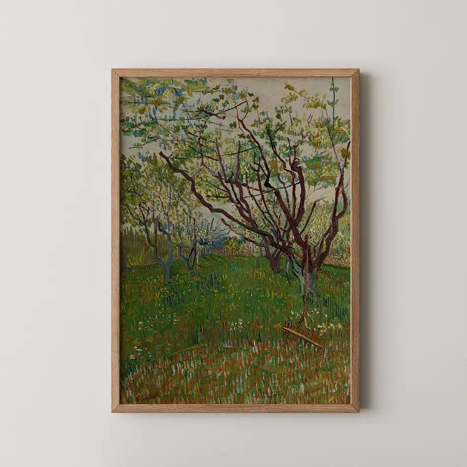 Framed painting of a blossoming orchard with lush green grass and trees in a serene landscape.