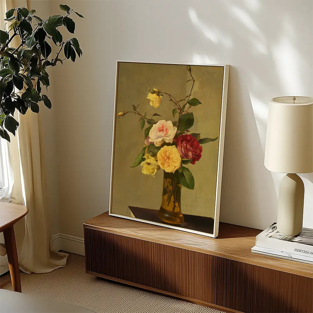 Painting of a bouquet of roses in a vase, elegantly displayed on a wooden surface beside a lamp.