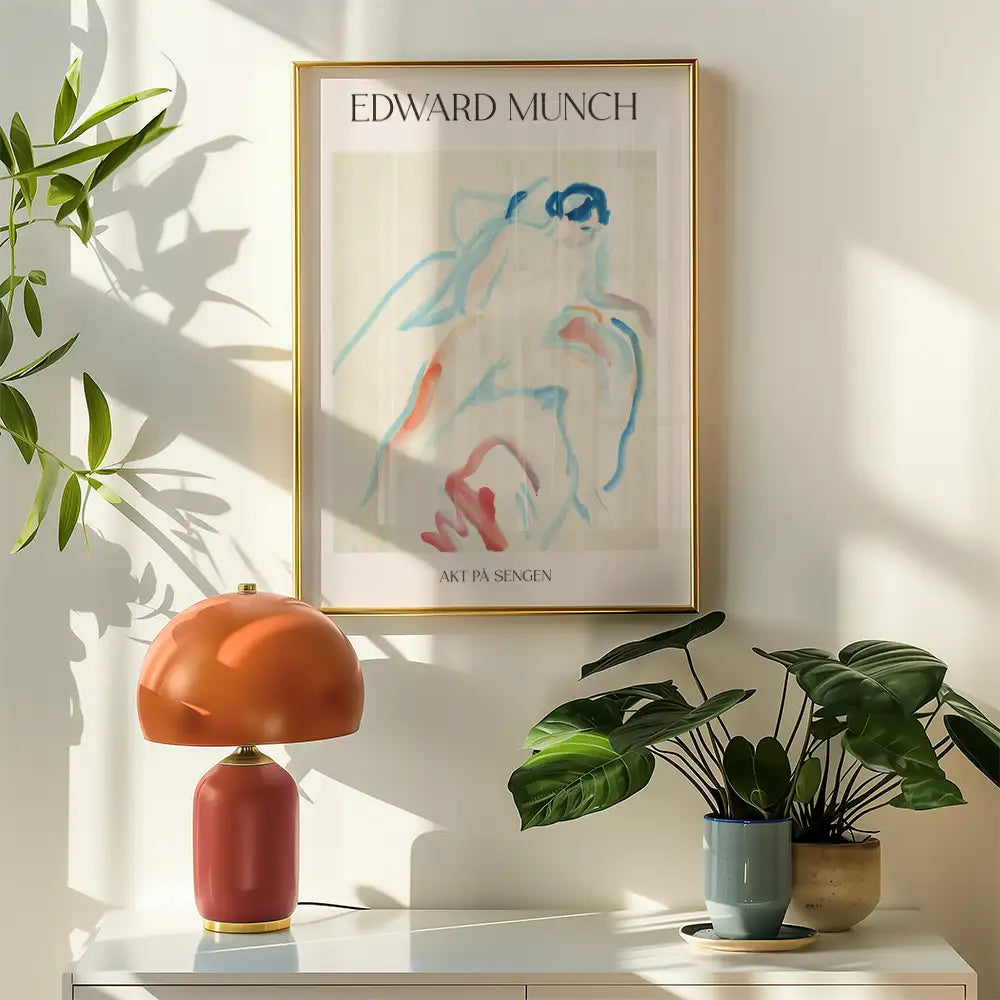 Painting of an abstract figure by Edward Munch titled "Akt på Sengen," framed and displayed on a wall with a stylish lamp and potted plants.