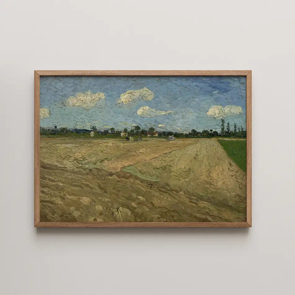 Framed painting of a rural landscape featuring fields and a blue sky with clouds.