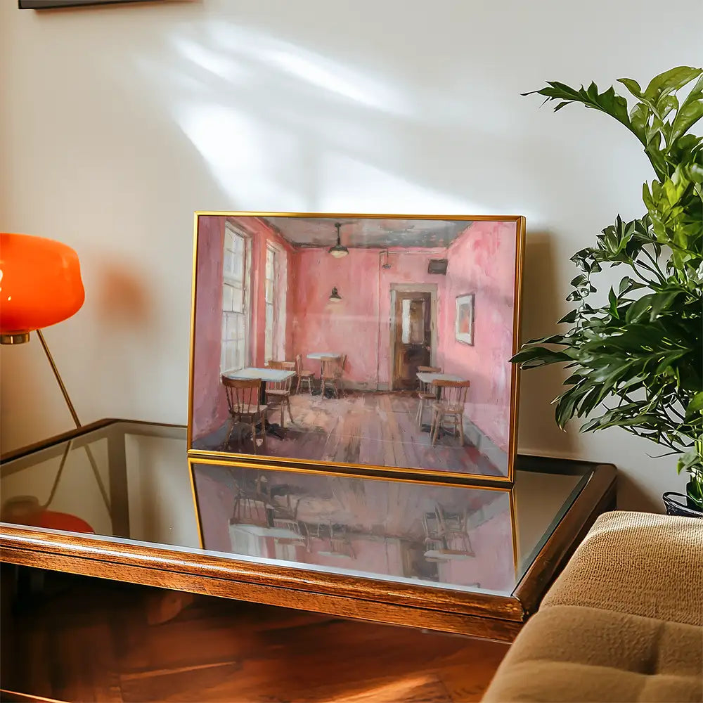 Modern poster reprint of a famous painting featuring a cozy interior with pink walls, wooden furniture, and natural lighting, displayed on a stylish table in a contemporary living space.