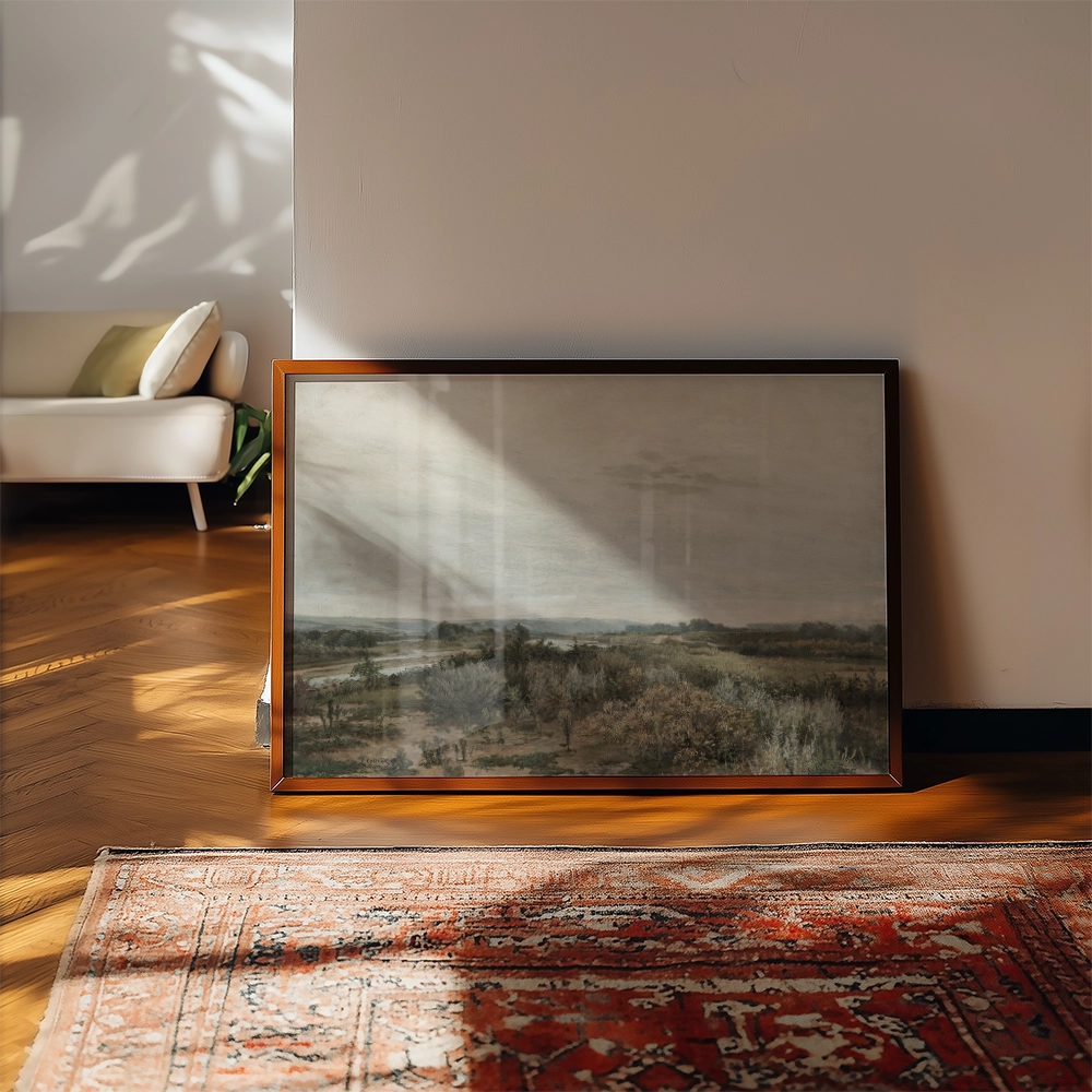 Framed painting of a serene landscape, leaning against a wall in a sunlit room with wooden flooring and a decorative rug.