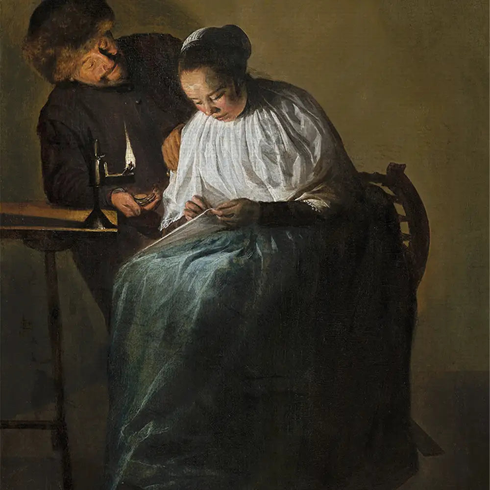 A man and woman in historical attire, illuminated by a candle, the woman focused on sewing while the man assists her in a dimly lit room.