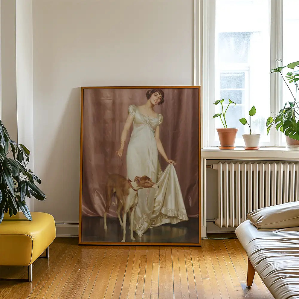 Painting of a woman in a white dress holding fabric with a greyhound dog at her side, framed and displayed in a modern room setting.