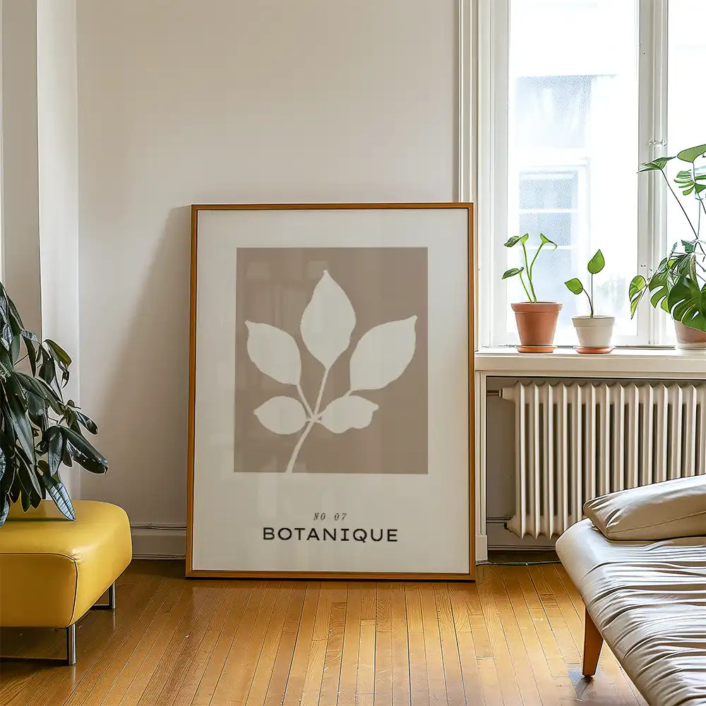 Modern botanical poster titled "Botanique" featuring minimalist leaf design, framed in wood, showcasing a neutral color palette, perfect for home decor.