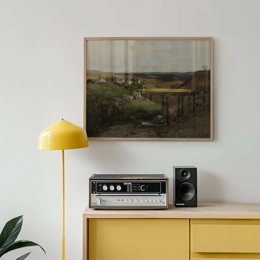 Painting of a scenic landscape hanging on a wall above a yellow lamp and a stereo system in a modern living room.