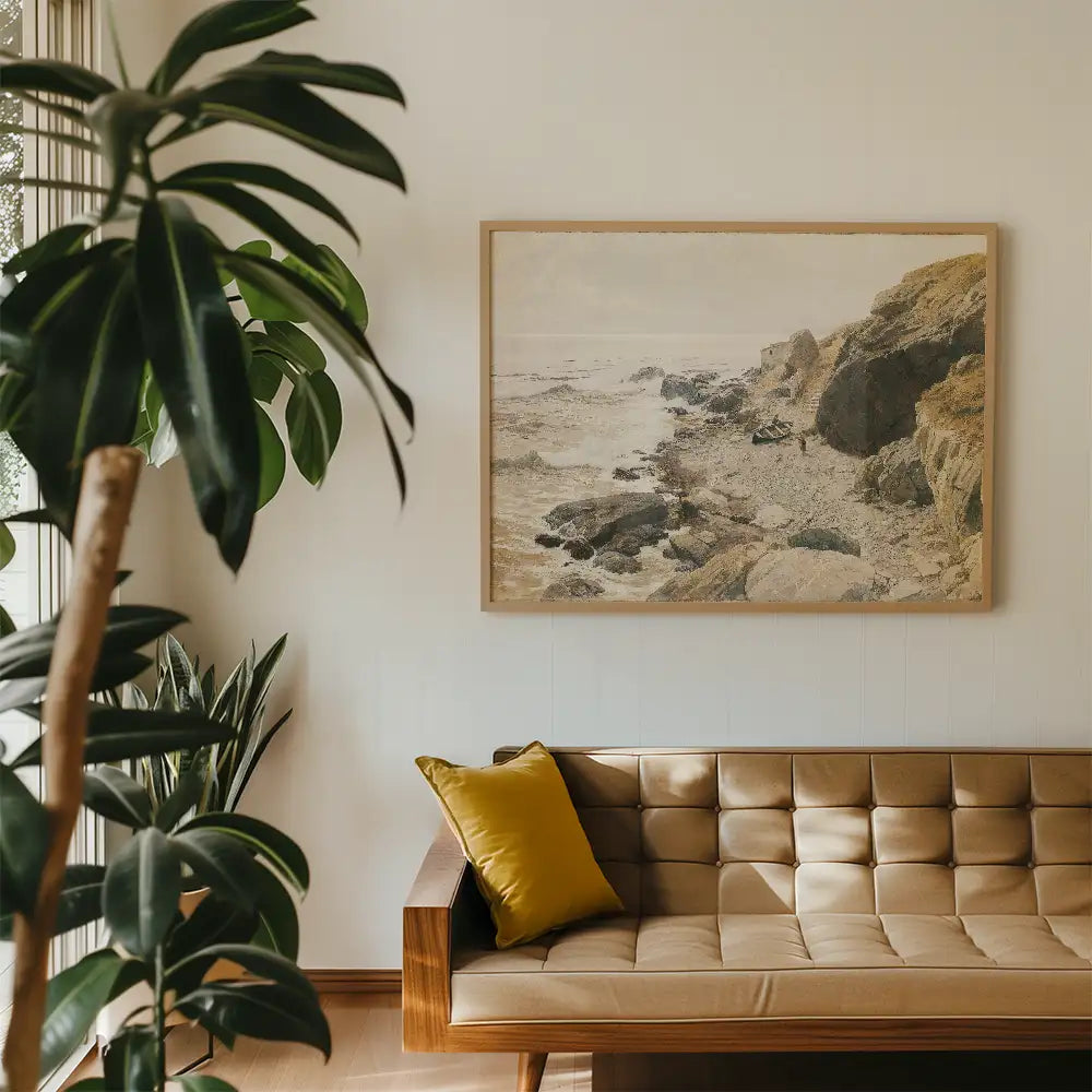 Framed landscape painting of rocky shoreline hanging on a wall above a modern tan sofa with a yellow cushion and indoor plants.