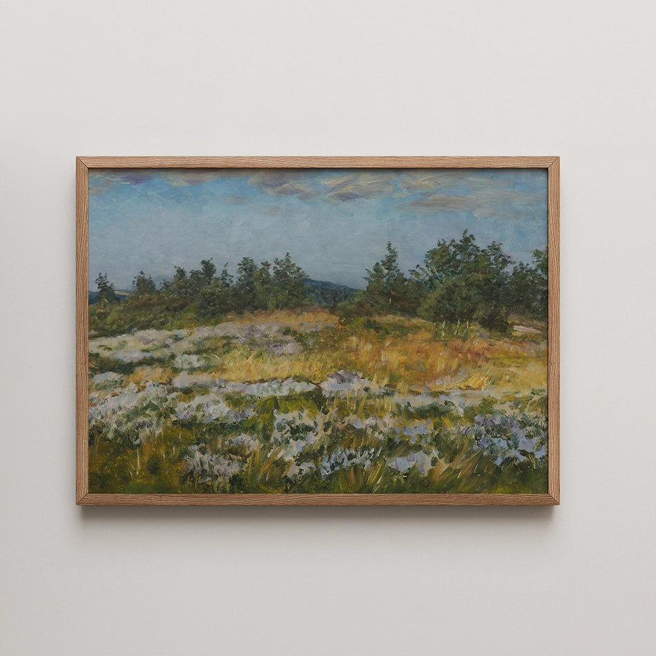 Landscape painting with a blue sky, green trees, and a field of wildflowers in a wooden frame.