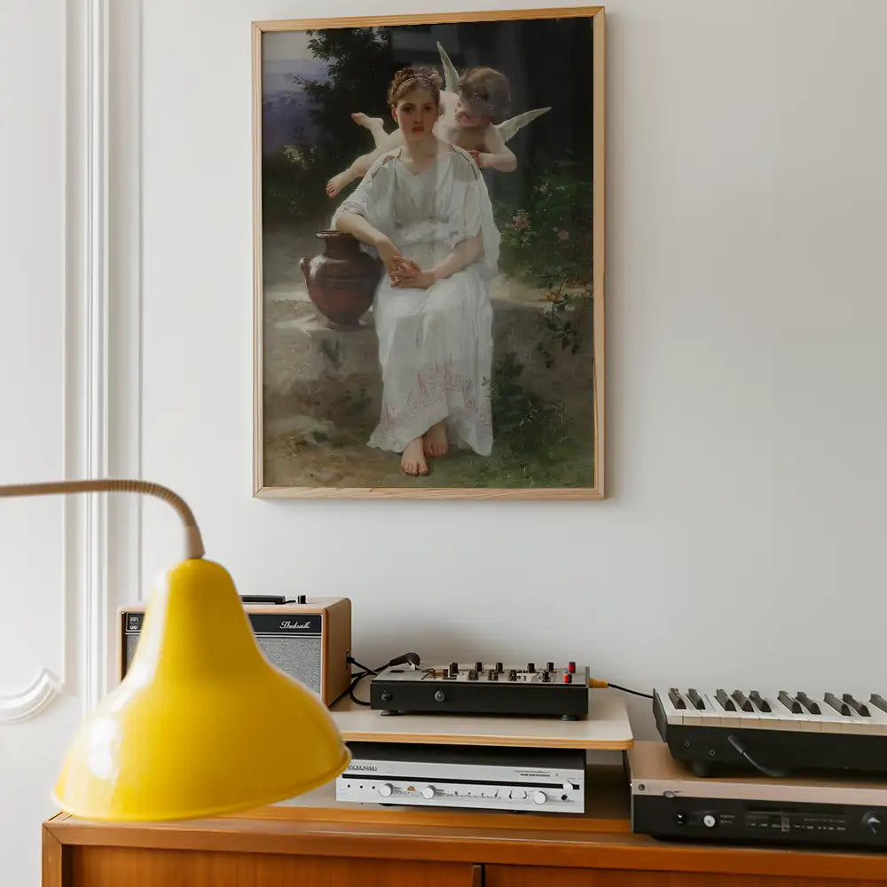 Painting of a woman in a white dress sitting beside a pot, accompanied by two winged cherubs, displayed on a wall above a vintage record player and a yellow lamp.