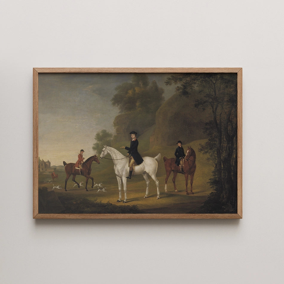 Framed painting featuring two riders on horseback in a picturesque landscape with hounds, depicting a serene hunting scene.