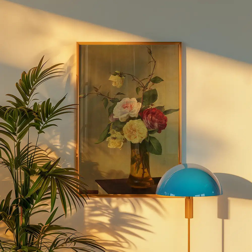 Painting of a floral arrangement in a vase displayed in a modern interior with a plant and a lamp.