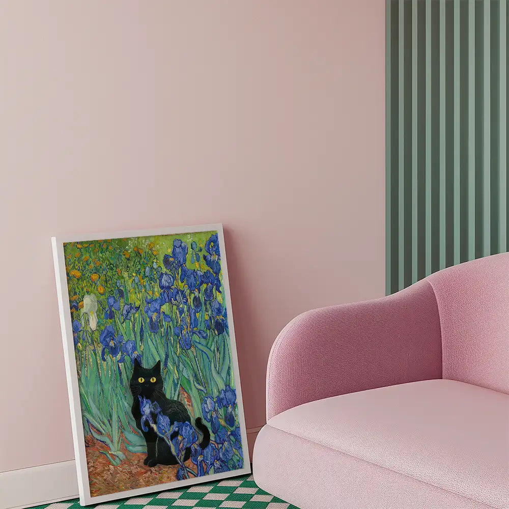 A vibrant painting featuring a black cat among blooming blue irises, displayed against a pastel pink wall and a curved pink sofa.