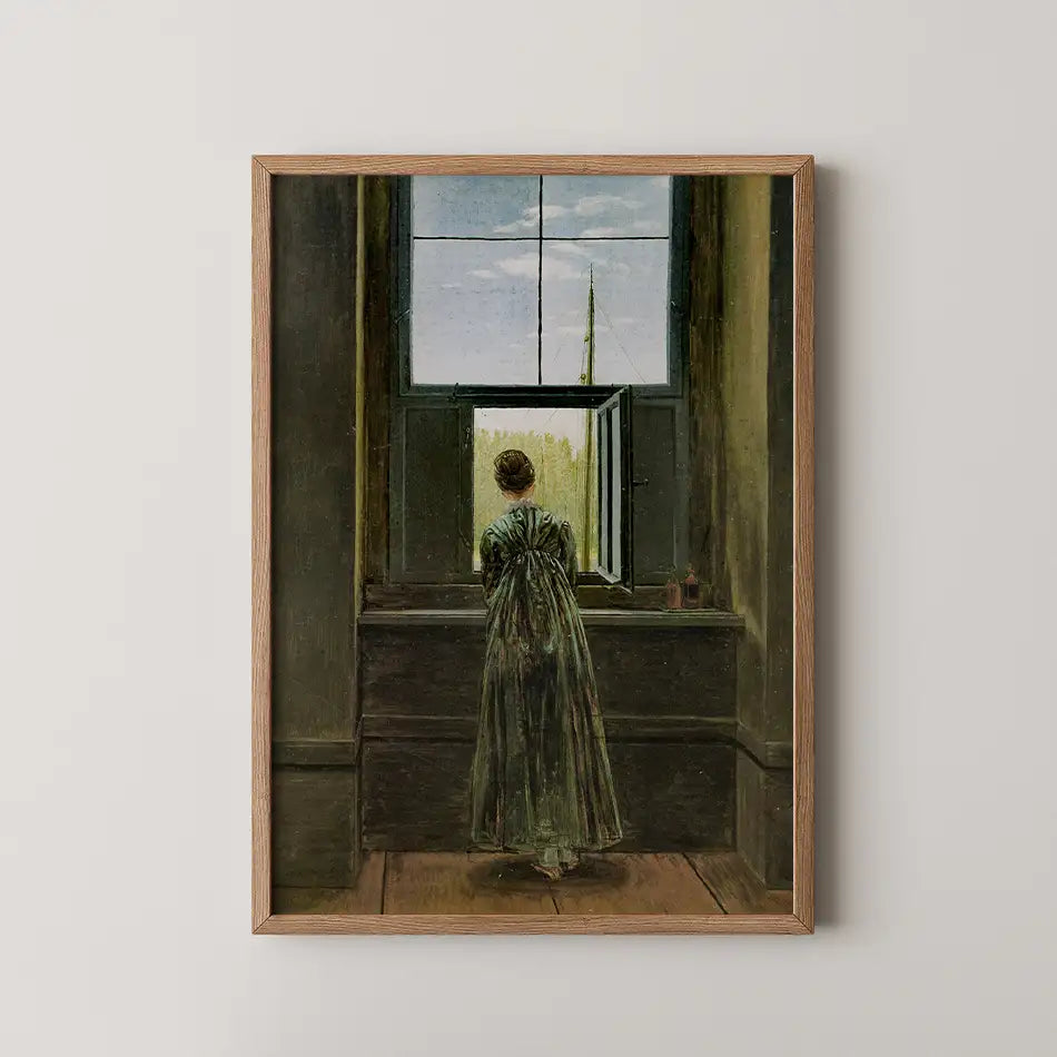 Painting of a woman in a green dress looking out of a window, framed in wood.