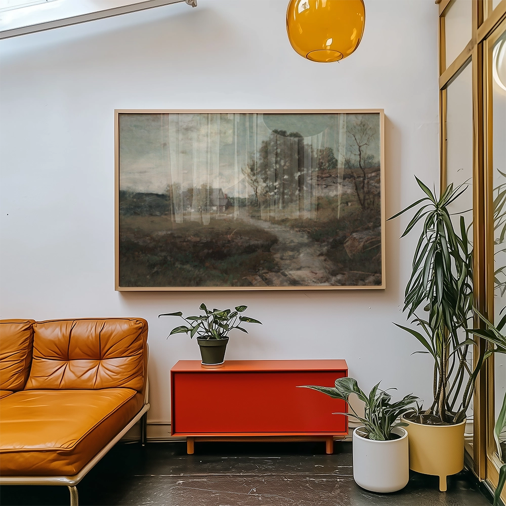 Painting of a serene landscape with a pathway, framed and displayed on a wall above a modern orange couch and a red cabinet, surrounded by indoor plants.