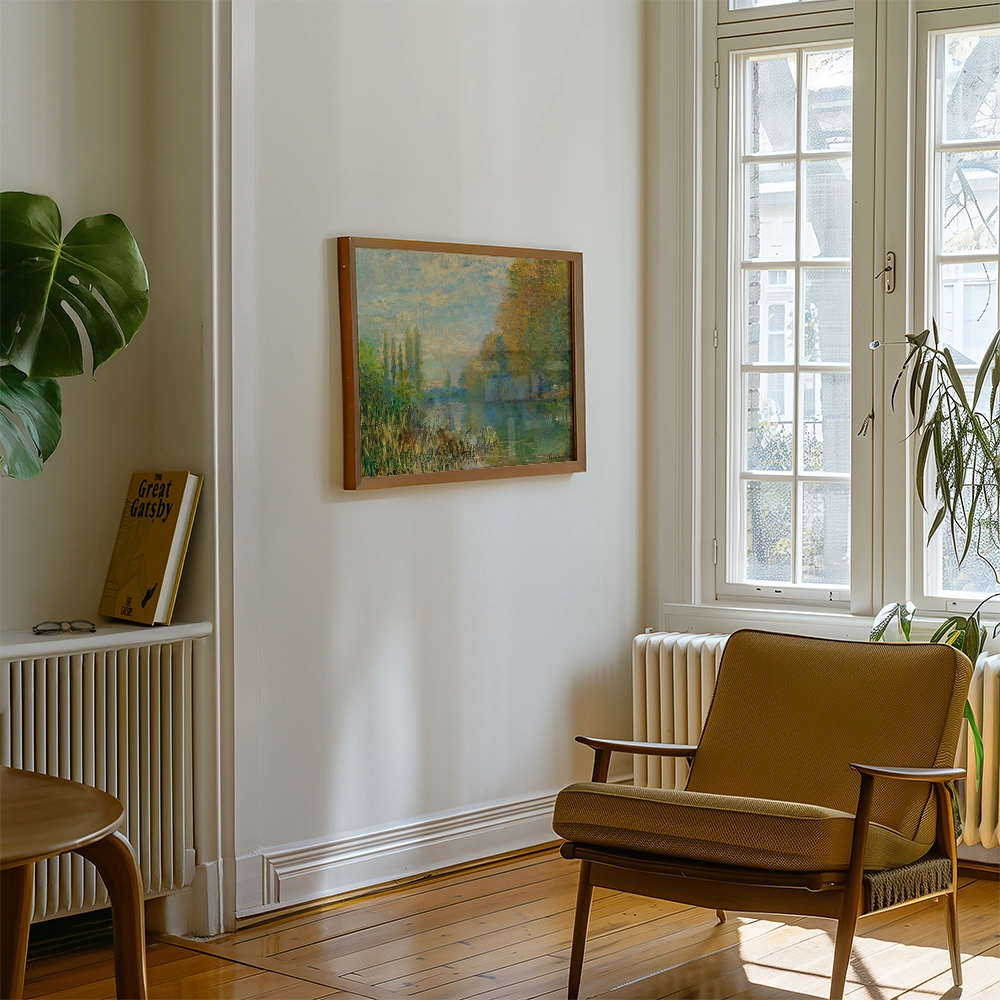Painting in a wooden frame hanging on a wall, surrounded by a green plant and a cozy chair in a well-lit room.
