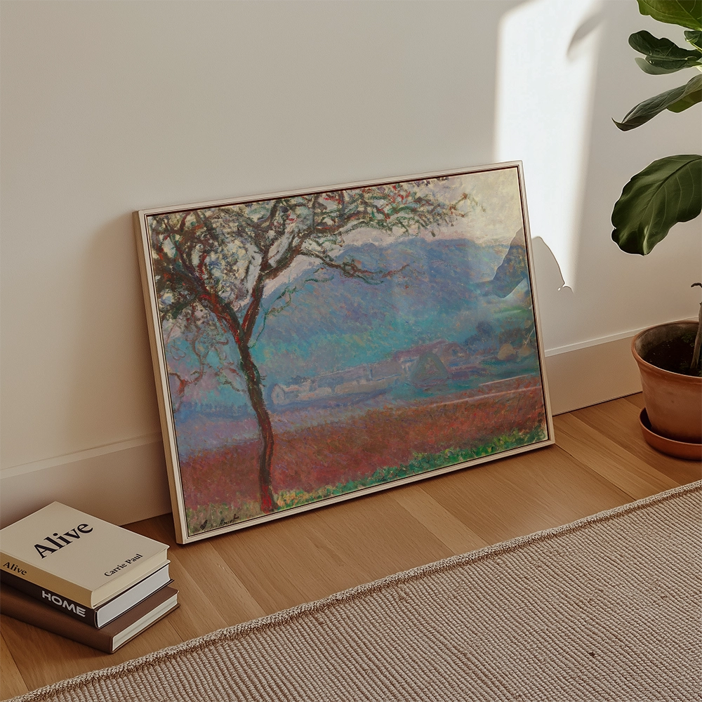 Framed painting of a vibrant landscape featuring a tree and rolling hills, leaning against a wall next to potted plants and books.