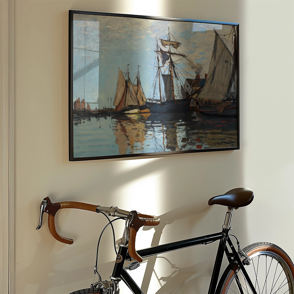 Painting of sailboats in a harbor, framed and hung on a wall, with a vintage bicycle leaning against the wall beneath it.
