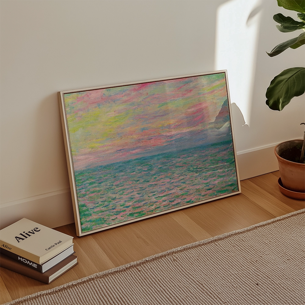 Framed abstract painting with colorful sky and ocean scene, leaning against a wall in a bright room.