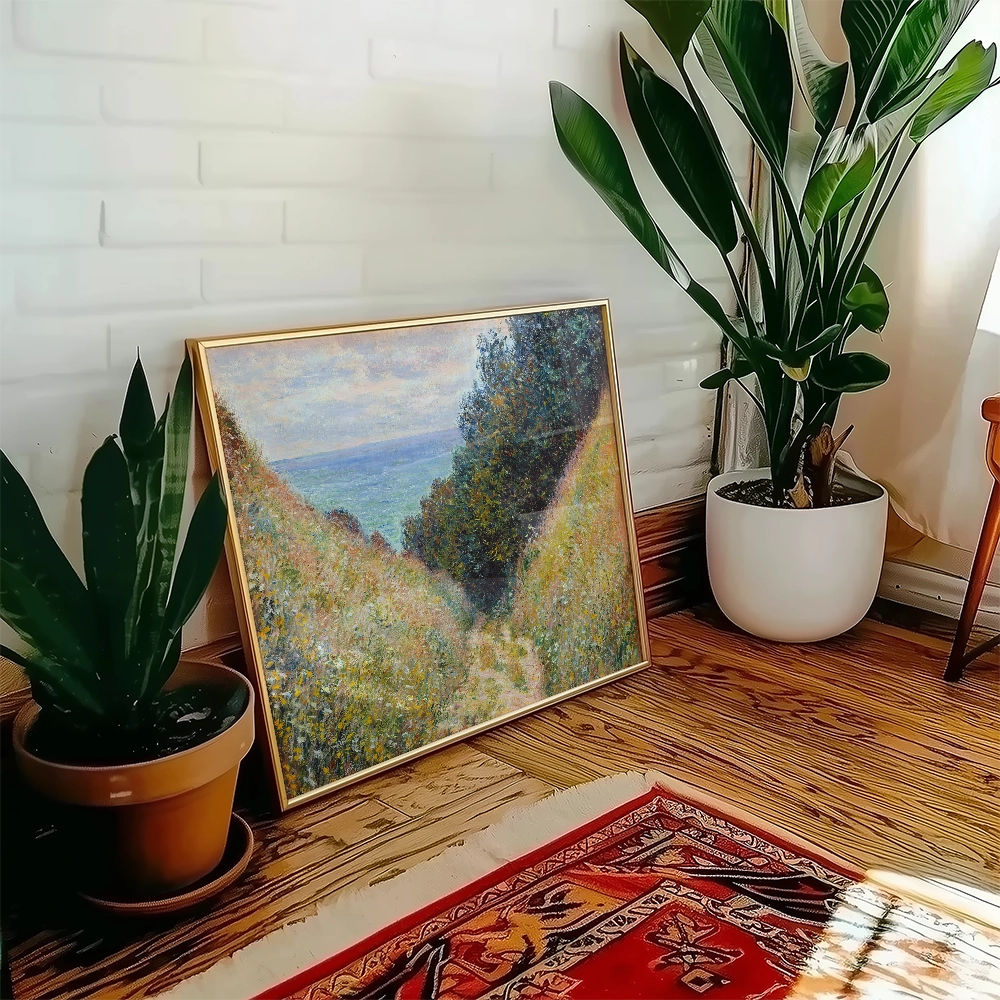 Painting of a serene landscape featuring rolling green hills and a distant body of water, displayed in a gold frame next to indoor plants in a cozy room setting.