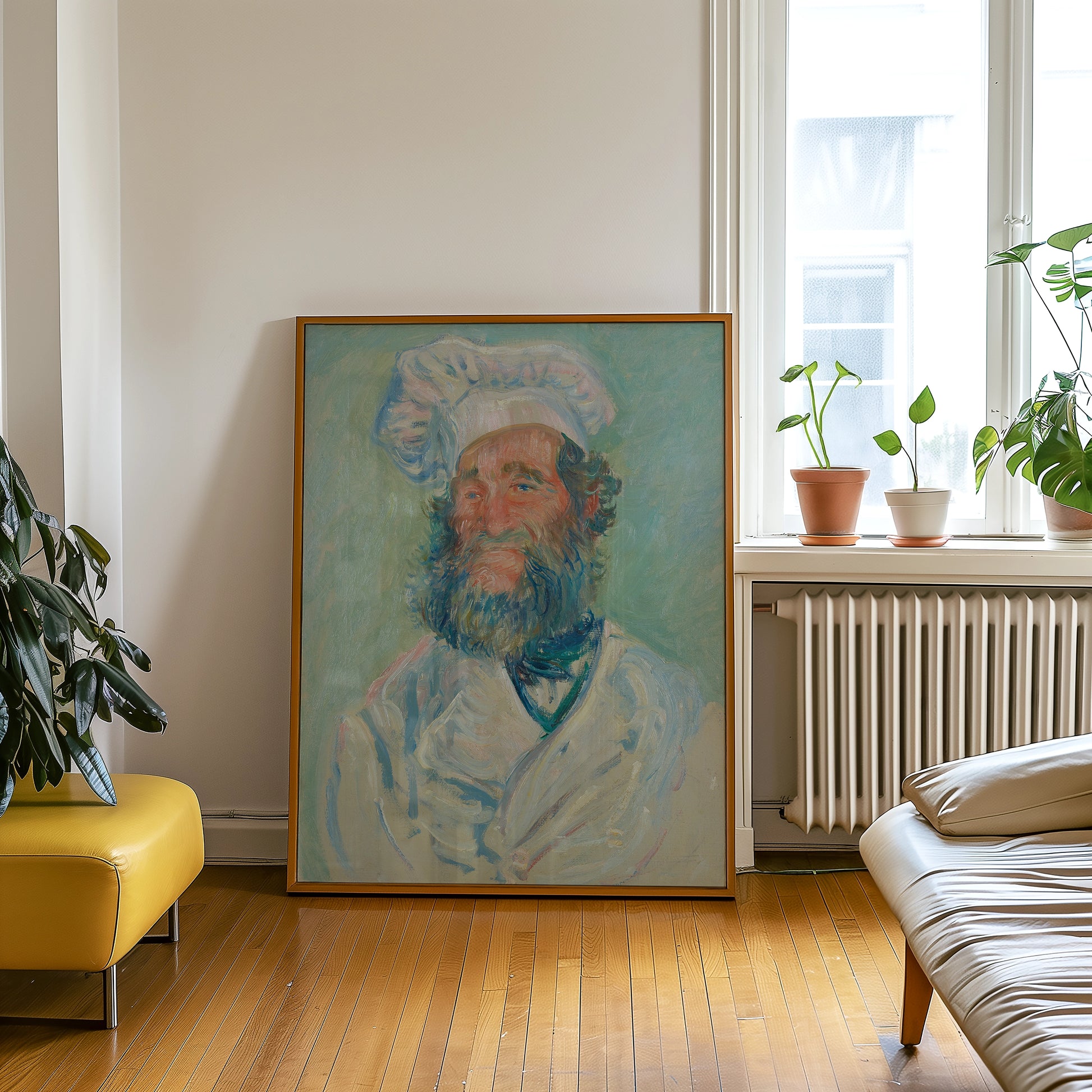 Portrait of a chef with a beard and chef's hat in a wooden frame, displayed in a modern interior setting with plants and furniture.