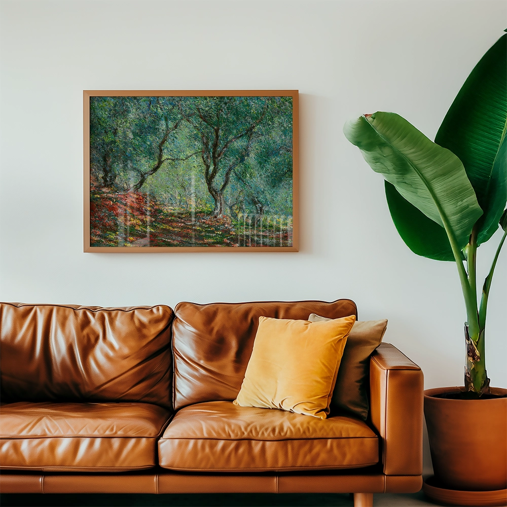 Painting of a serene landscape with trees and colorful foliage, framed and hung above a stylish brown leather couch with cushions, beside a large green plant in a pot.