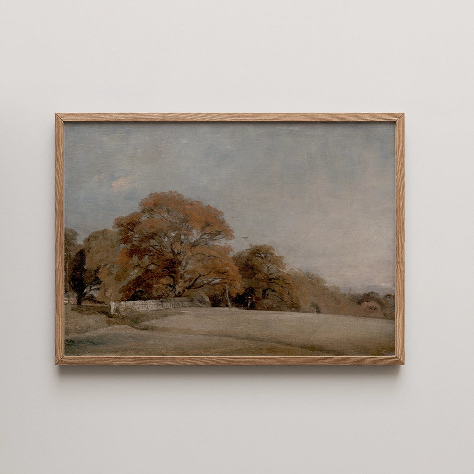Framed painting of a serene landscape featuring trees with autumn foliage under a cloudy sky.