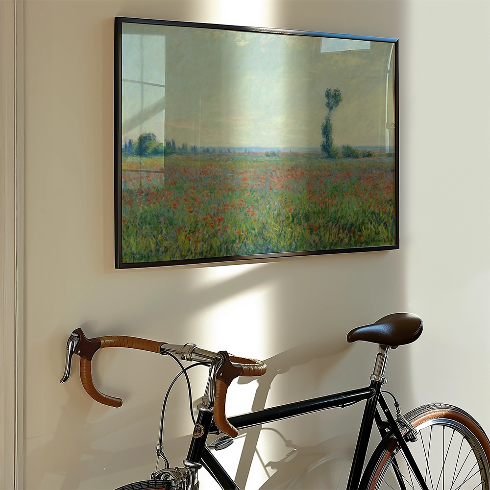 Framed painting of a colorful field with flowers, hanging on a wall next to a bicycle.