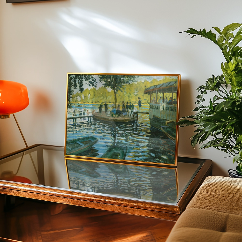 Framed painting of a serene riverside scene with people enjoying a boat ride, displayed on a glass table in a stylish living room setting.
