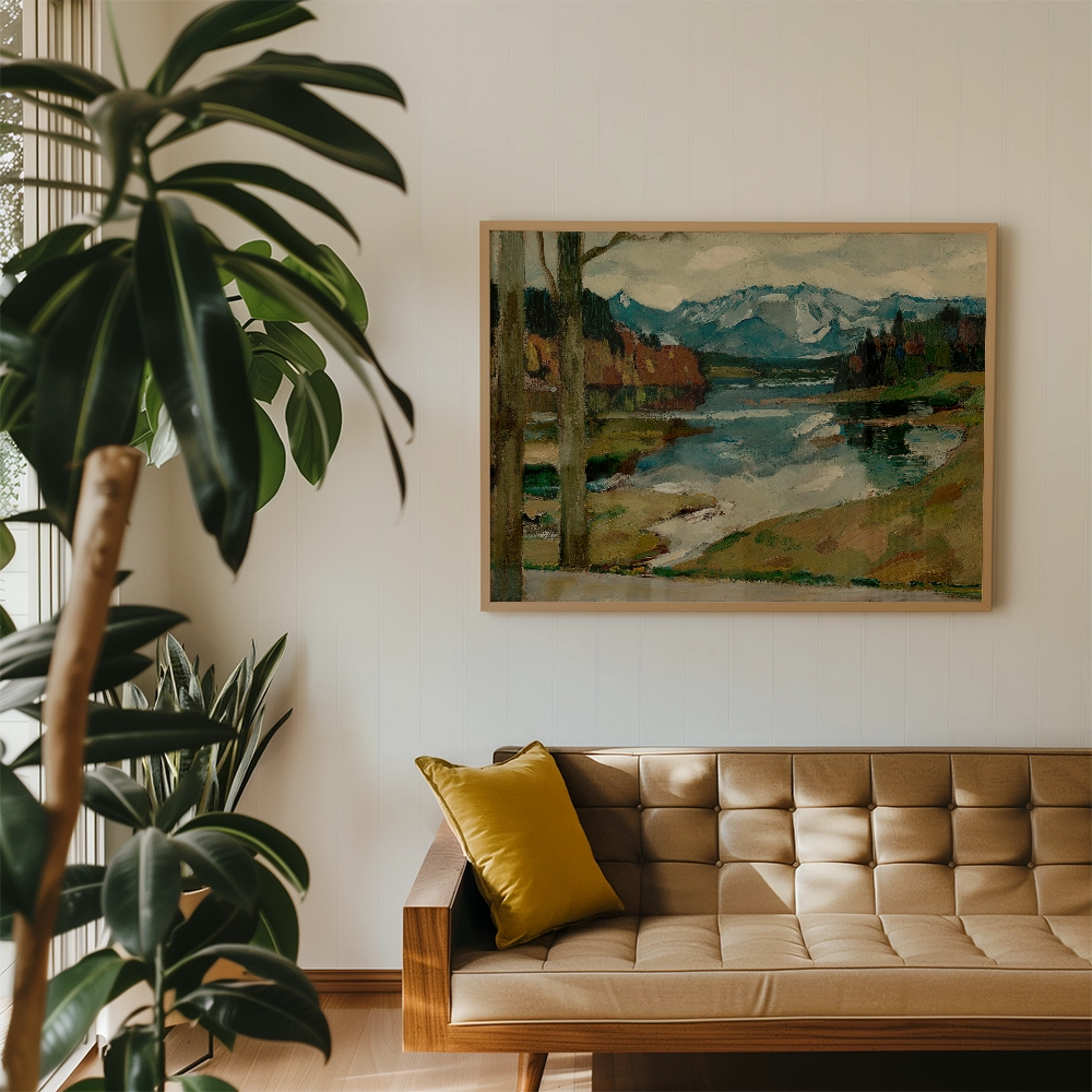 A framed painting of a serene landscape featuring mountains, a river, and trees, hanging on a light-colored wall above a modern brown sofa with a yellow cushion and indoor plants nearby.