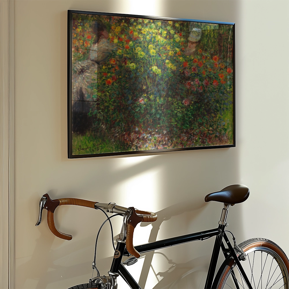 Framed painting of a vibrant flower garden hanging on a wall next to a black bicycle.