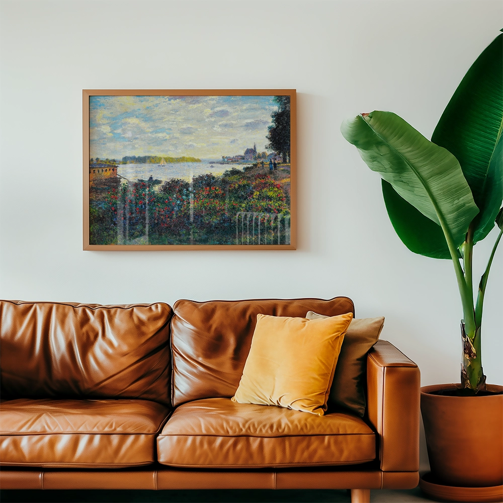 Framed landscape painting above a brown leather sofa with decorative cushions and a large green plant in a pot.