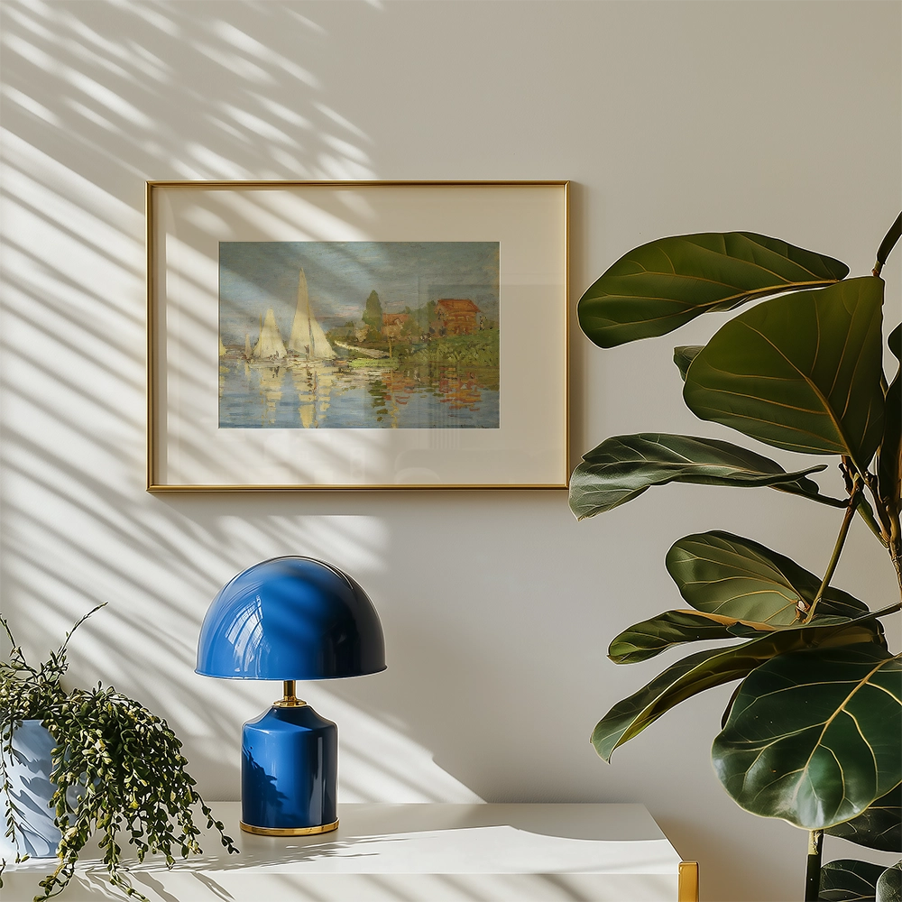 Framed painting of sailboats on a serene lake with reflections, accompanied by stylish decor elements such as a blue lamp and potted plant.