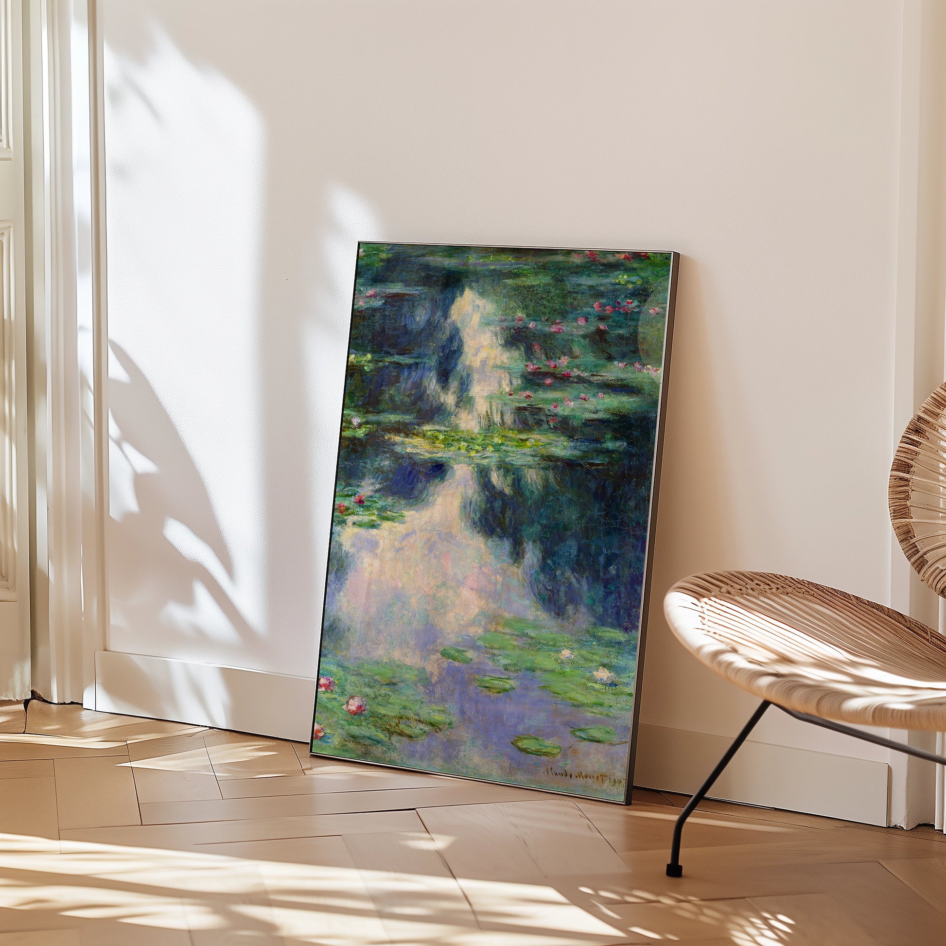 Painting of water lilies reflected in water, leaning against a wall in a modern interior setting.