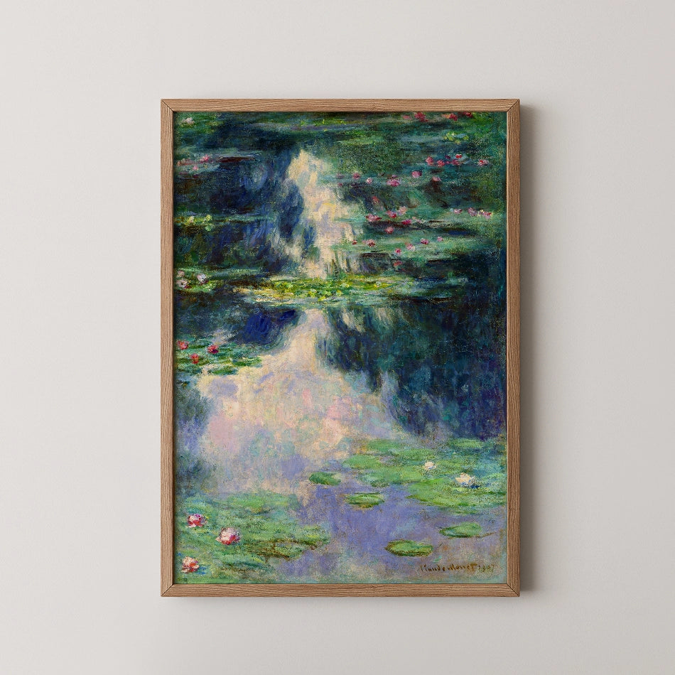 Framed painting of water lilies reflecting in calm water, featuring soft blues and greens with hints of pink flowers.