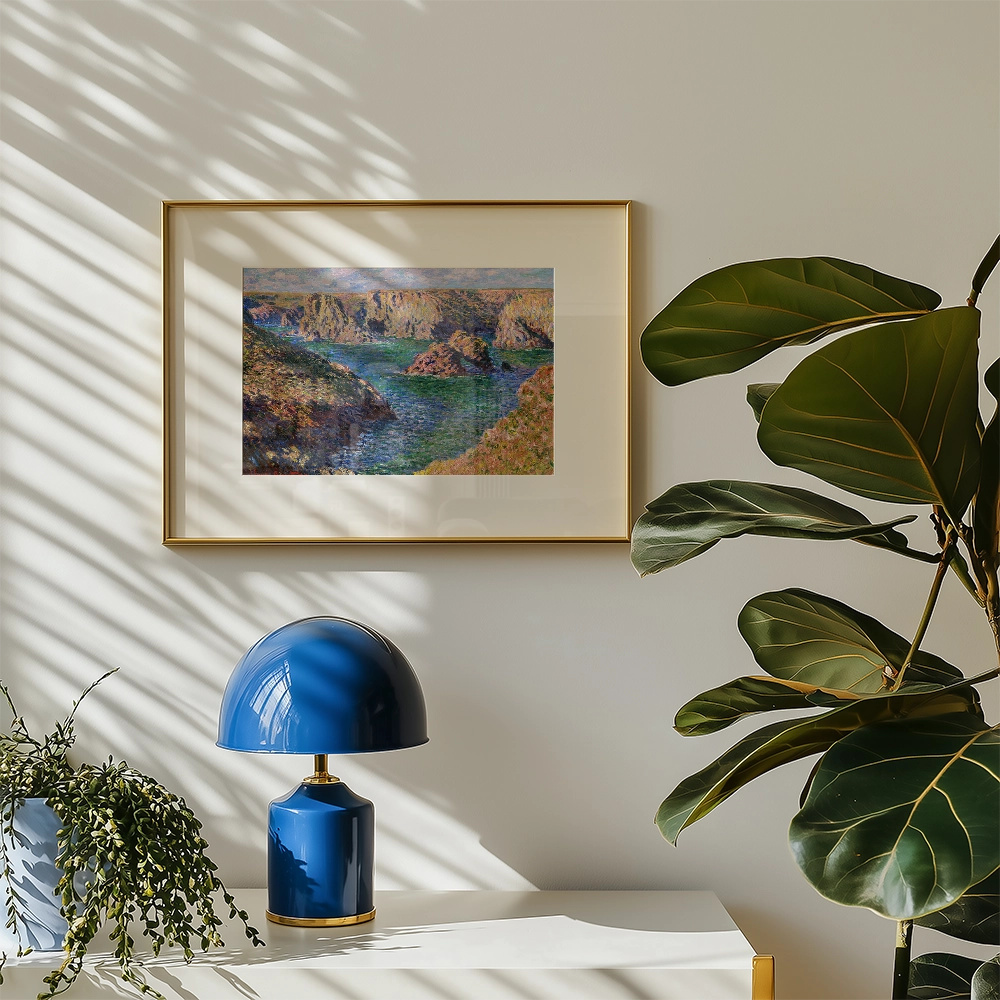 Framed painting of a green river landscape in a modern interior setting with a blue lamp and potted plant.
