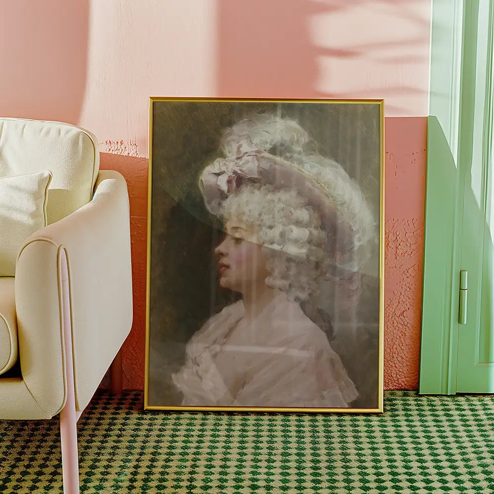 Painting of a woman with curly hair wearing a large hat, framed in gold, displayed against a pastel-colored wall and green door.