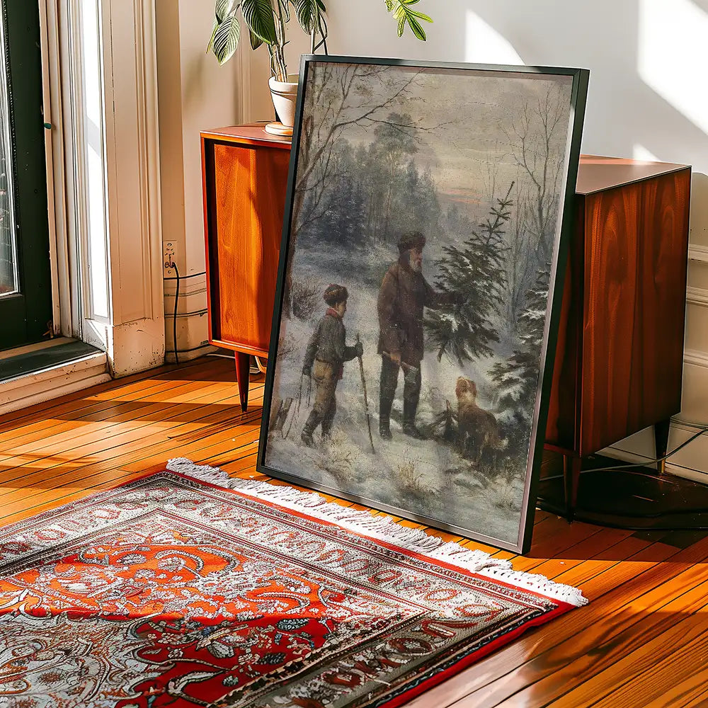 Framed painting of a winter scene featuring two figures, a dog, and evergreen trees, displayed in a bright interior space with wooden floors and a decorative rug.