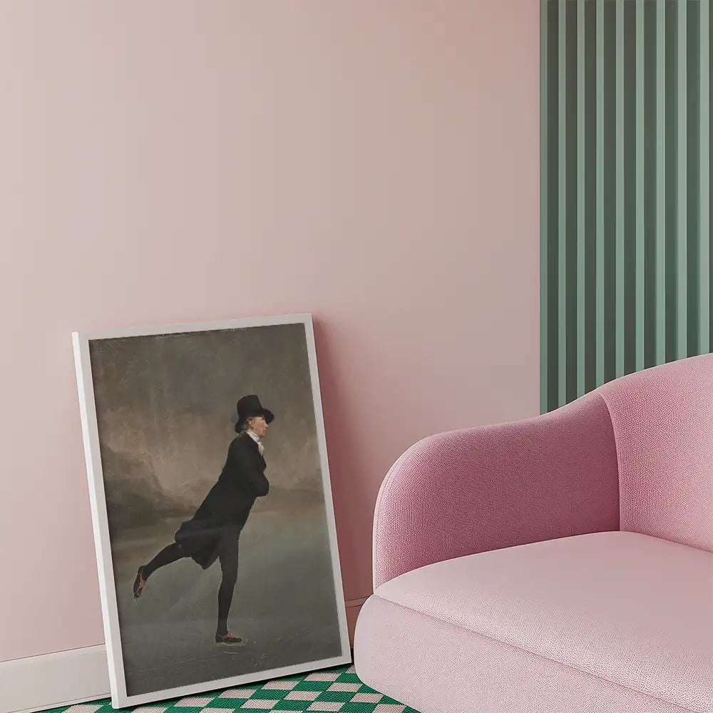 Framed painting of a figure in a black coat and hat against a muted background, leaning on one leg, positioned beside a pink sofa in a stylish interior setting.