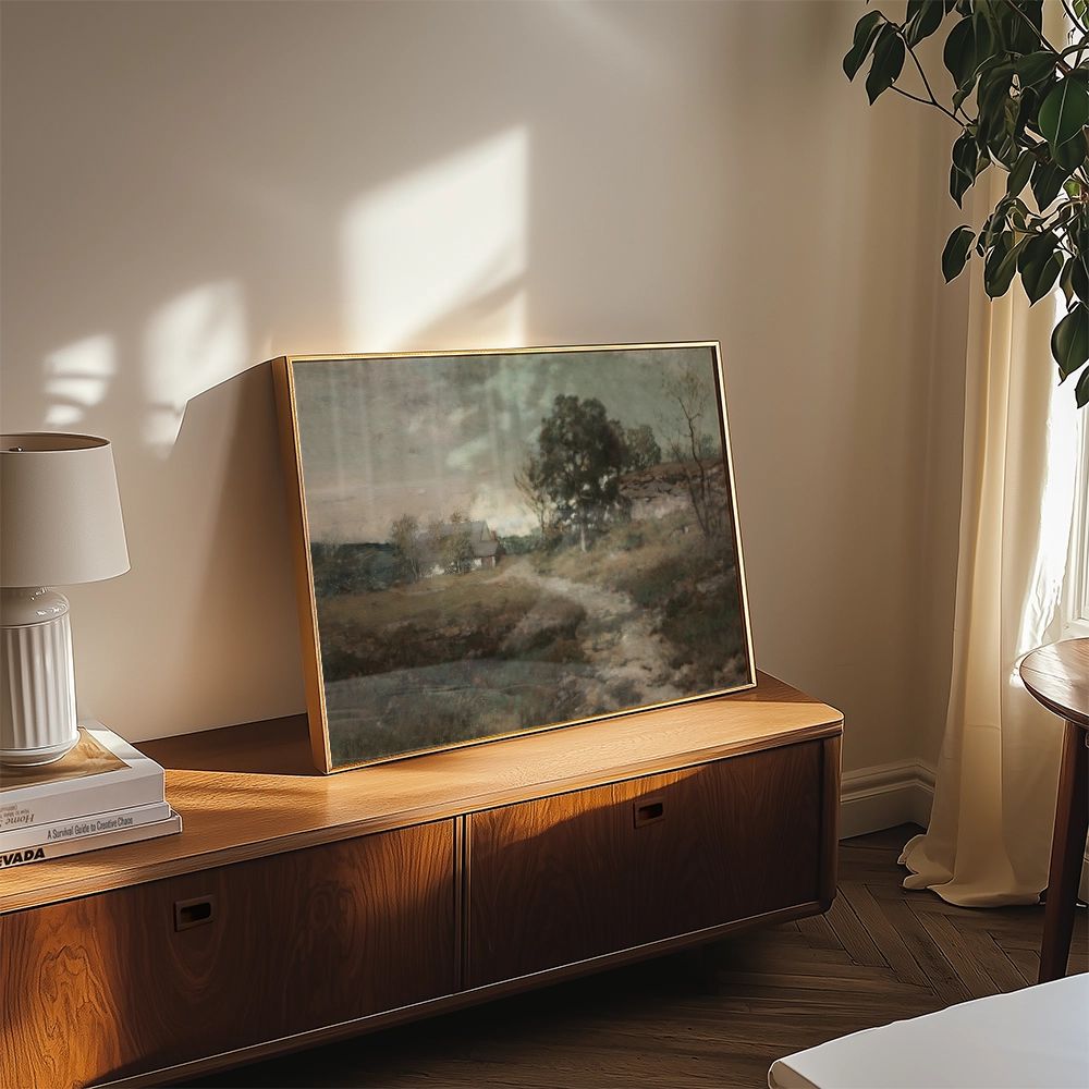 Painting displayed on a wooden sideboard in a well-lit room, featuring soft colors and landscape scenery.