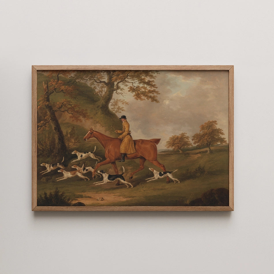 A classic painting featuring a rider on a horse accompanied by a pack of hunting dogs, set in a scenic landscape with trees and rolling hills.