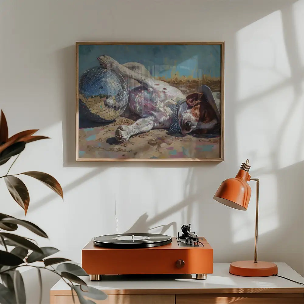 Modern poster of a dog lounging with a disco ball, framed artwork in a stylish interior setting with a record player and decorative lamp.
