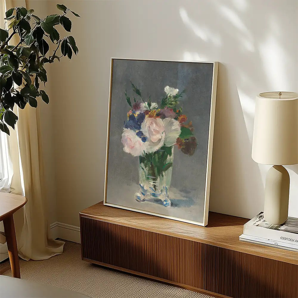 Painting of a bouquet of flowers in a glass vase, displayed in a stylish interior setting with natural light.