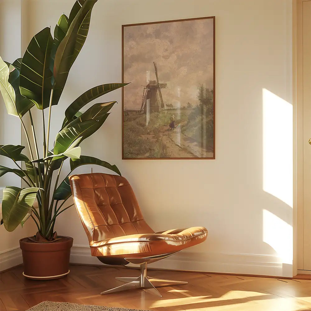 A cozy corner featuring a modern brown lounge chair beside a large potted plant, with a vintage windmill painting on the wall, illuminated by natural sunlight.