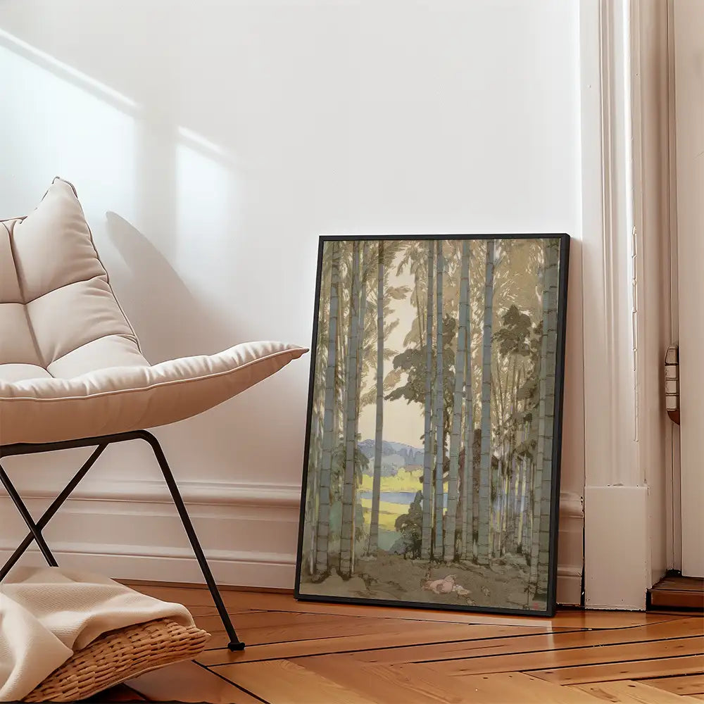 Framed painting of a serene forest scene featuring tall trees and a subtle landscape, placed beside a modern chair in a cozy interior setting.