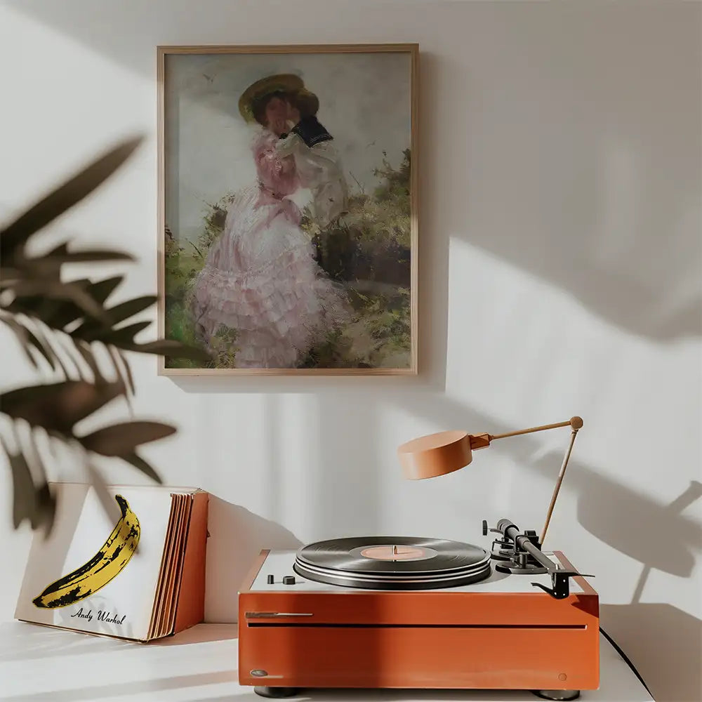 Stylish interior featuring a vintage record player, framed painting of a woman in a pink dress, and decorative elements.