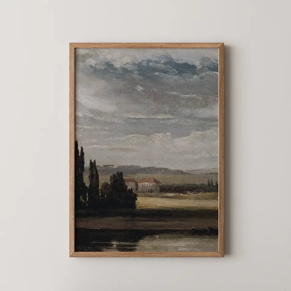 Framed landscape painting featuring a serene scene with a river, dark trees, and distant hills under a cloudy sky.