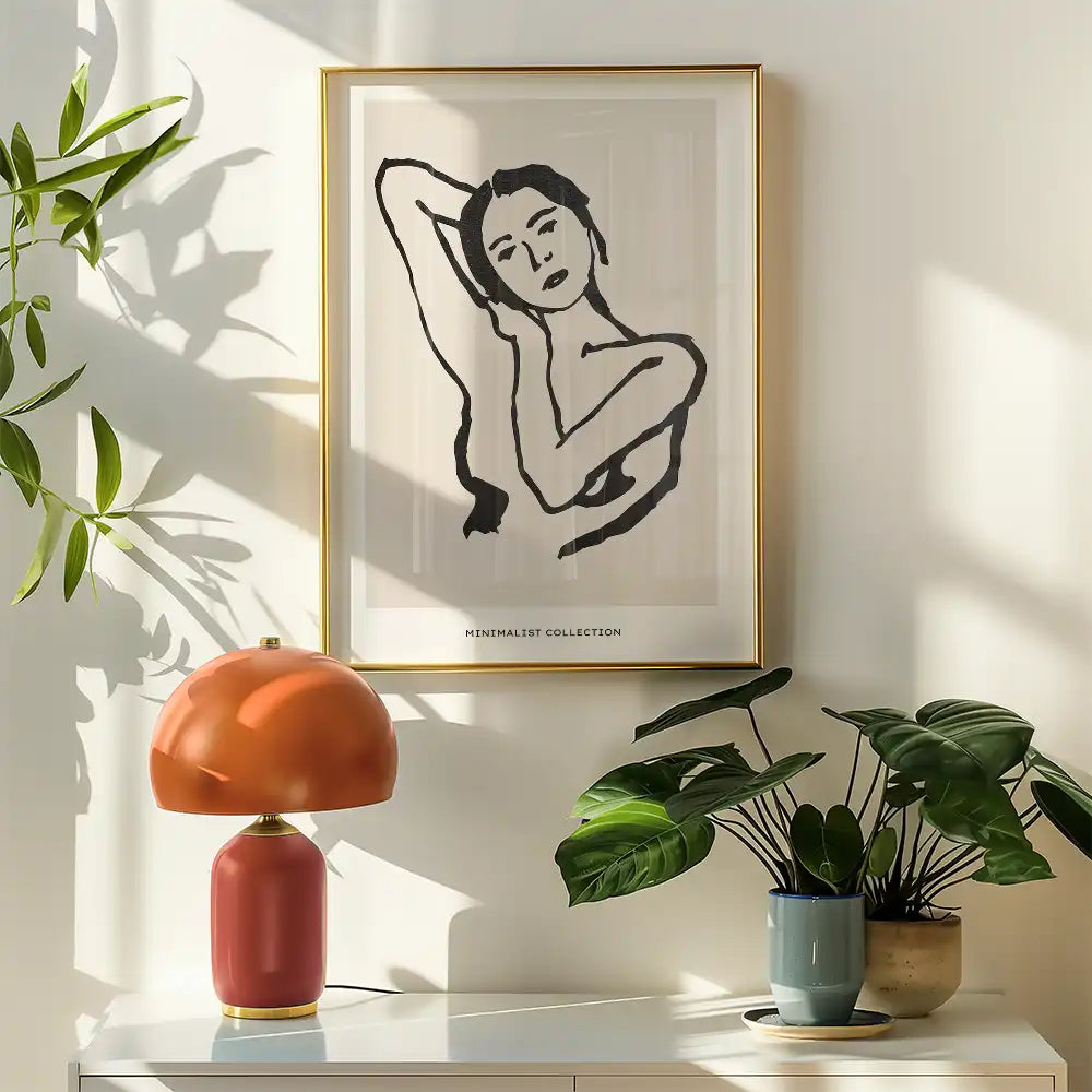 Modern minimalist poster of a famous painting featuring a contemplative woman, framed in gold, displayed in a sunlit room with plants and a stylish lamp.